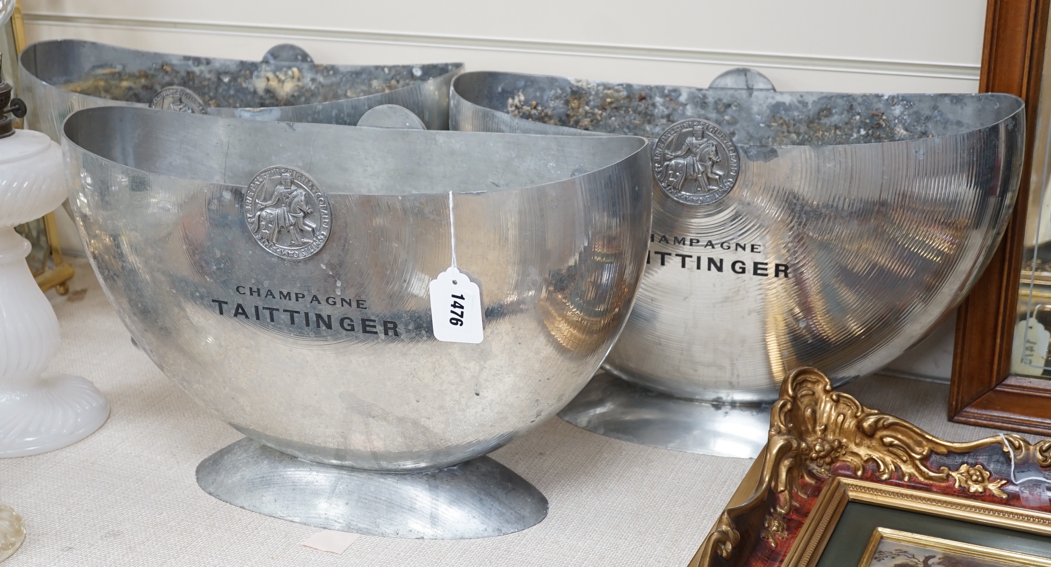 Three champagne Taittinger pewter wine coolers, 47cms wide x 30cms high